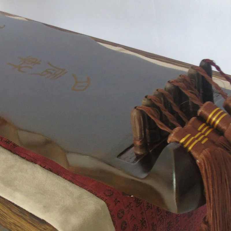 نقش مجاني لآلة الغوتشين الصيني - مراجعة Musical Instrument Book وسعره