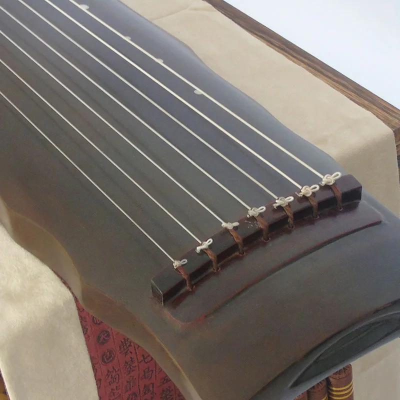 نقش مجاني لآلة الغوتشين الصيني - مراجعة Musical Instrument Book وسعره